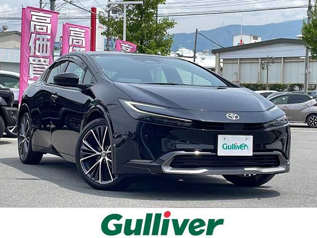 トヨタ プリウス Z 長野県 2024(令6)年 1.3万km アティチュードブラックマイカ ガラスルーフ/純正12.3インチディスプレイオーディオ（ナビ機能有り）/FM・AM・BT・フルセグTV・AppleCarPlay/全方位カメラ・バックカメラ/前席シートヒーター・ベンチレーション/レーダークルーズコントロール/純正19インチアルミホイール/前後コーナーセンサー/トヨタセーフティセンス/ステアリングヒーター/ワイパーデアイサー/D席パワーシート/電動パーキング/ブレーキHOLD/LEDヘッドライト/パワーバックドア/プッシュスタート/ドアバイザー/スマートキー/スペア1本/AC100V/ETC2.0