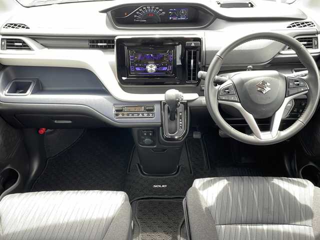 スズキ ソリオ HV MZ 道東・釧路十勝 2024(令6)年 2.4万km ピュアホワイトP 4WD/ワンオーナー/社外オーディオ/CD/BT/USB/AUX/両側パワースライドドア/前席シートヒーター/ヘッドアップディスプレイ/デュアルカメラブレーキサポート/追従クルーズコントロール/ハイビームアシスト/レーンキープアシスト/リアパーキングセンサー/サイドカーテンエアバック/スリムサーキュレーター/シートバックテーブル/後席ドアロールサンシェード/LEDヘッドライト/LEDフォグライト/純正15インチアルミホイール/純正フロアマット