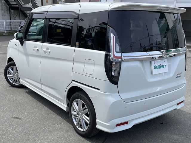 スズキ ソリオ HV MZ 道東・釧路十勝 2024(令6)年 2.4万km ピュアホワイトP 4WD/ワンオーナー/社外オーディオ/CD/BT/USB/AUX/両側パワースライドドア/前席シートヒーター/ヘッドアップディスプレイ/デュアルカメラブレーキサポート/追従クルーズコントロール/ハイビームアシスト/レーンキープアシスト/リアパーキングセンサー/サイドカーテンエアバック/スリムサーキュレーター/シートバックテーブル/後席ドアロールサンシェード/LEDヘッドライト/LEDフォグライト/純正15インチアルミホイール/純正フロアマット