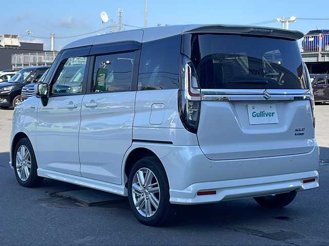 スズキ ソリオ HV MZ 道東・釧路十勝 2024(令6)年 2.4万km ピュアホワイトP 4WD/ワンオーナー/社外オーディオ/CD/BT/USB/AUX/両側パワースライドドア/前席シートヒーター/ヘッドアップディスプレイ/デュアルカメラブレーキサポート/追従クルーズコントロール/ハイビームアシスト/レーンキープアシスト/リアパーキングセンサー/サイドカーテンエアバック/スリムサーキュレーター/シートバックテーブル/後席ドアロールサンシェード/LEDヘッドライト/LEDフォグライト/純正15インチアルミホイール/純正フロアマット