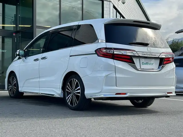 ホンダ オデッセイ アブソルート 愛媛県 2014(平26)年 6.3万km ホワイトオーキッドパール 純正ナビ/全周囲カメラ/両側パワースライドドア/純正フリップダウンモニター/HDMI入力端子/USB入力端子/パドルシフト/クルーズコントロール/LEDヘッドライト/オートライト/電格ミラー/ヒートミラー/ETC/アイドリングストップ/ドアバイザー/無限フロアマット/純正18インチAW(社外センターキャップ)/現状サマー(社外AW)(225/45/ZR18)/MINERVA RADIAL F205