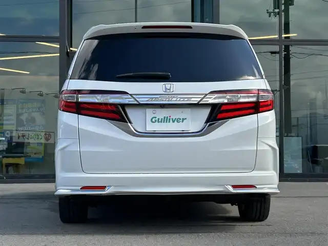 ホンダ オデッセイ アブソルート 愛媛県 2014(平26)年 6.3万km ホワイトオーキッドパール 純正ナビ/全周囲カメラ/両側パワースライドドア/純正フリップダウンモニター/HDMI入力端子/USB入力端子/パドルシフト/クルーズコントロール/LEDヘッドライト/オートライト/電格ミラー/ヒートミラー/ETC/アイドリングストップ/ドアバイザー/無限フロアマット/純正18インチAW(社外センターキャップ)/現状サマー(社外AW)(225/45/ZR18)/MINERVA RADIAL F205