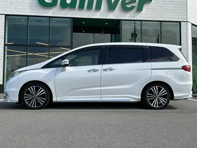 ホンダ オデッセイ アブソルート 愛媛県 2014(平26)年 6.3万km ホワイトオーキッドパール 純正ナビ/全周囲カメラ/両側パワースライドドア/純正フリップダウンモニター/HDMI入力端子/USB入力端子/パドルシフト/クルーズコントロール/LEDヘッドライト/オートライト/電格ミラー/ヒートミラー/ETC/アイドリングストップ/ドアバイザー/無限フロアマット/純正18インチAW(社外センターキャップ)/現状サマー(社外AW)(225/45/ZR18)/MINERVA RADIAL F205