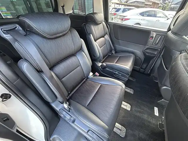 ホンダ オデッセイ アブソルート 愛媛県 2014(平26)年 6.3万km ホワイトオーキッドパール 純正ナビ/全周囲カメラ/両側パワースライドドア/純正フリップダウンモニター/HDMI入力端子/USB入力端子/パドルシフト/クルーズコントロール/LEDヘッドライト/オートライト/電格ミラー/ヒートミラー/ETC/アイドリングストップ/ドアバイザー/無限フロアマット/純正18インチAW(社外センターキャップ)/現状サマー(社外AW)(225/45/ZR18)/MINERVA RADIAL F205