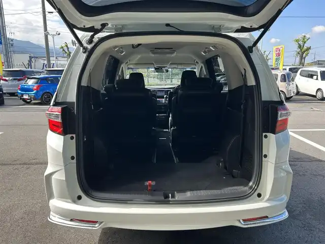 ホンダ オデッセイ アブソルート 愛媛県 2014(平26)年 6.3万km ホワイトオーキッドパール 純正ナビ/全周囲カメラ/両側パワースライドドア/純正フリップダウンモニター/HDMI入力端子/USB入力端子/パドルシフト/クルーズコントロール/LEDヘッドライト/オートライト/電格ミラー/ヒートミラー/ETC/アイドリングストップ/ドアバイザー/無限フロアマット/純正18インチAW(社外センターキャップ)/現状サマー(社外AW)(225/45/ZR18)/MINERVA RADIAL F205