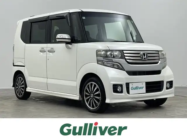 ホンダ Ｎ ＢＯＸ カスタム G ターボパッケージ 埼玉県 2013(平25)年 9.5万km タフタホワイトⅢ 純正7インチナビ/ フルセグTV Bluetooth CD DVD iPod/バックカメラ/両側パワースライドドア/クルーズコントロール/パドルシフト/ETC/純正フロアマット/純正15インチアルミホイール/オートライト/スマートキー/プッシュスタート/電動格納ミラー