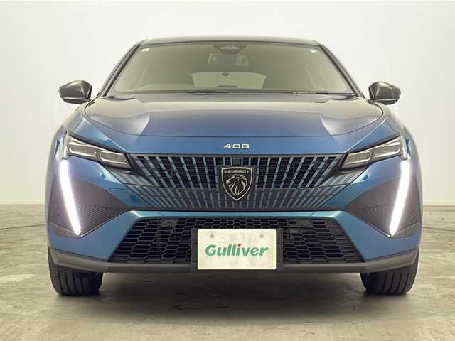 プジョー プジョー ４０８ GT ハイブリッド 三重県 2023(令5)年 3.9万km 青 禁煙車/純正ナビ（Bluetooth・AppleCarPlay・AndroidAuto）/アラウンドビューモニター/ブラインドスポットモニター/デジタルインナーミラー/パドルシフト/前席シートヒーター/前席パワーシート/パワーバックドア/電動パーキング/レーダークルーズコントロール/革巻きステアリング/ビルトインETC/置くだけ充電/LEDヘッドライト（オートライト）