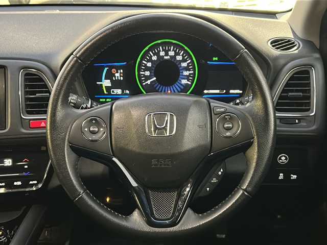 ホンダ ヴェゼル ハイブリッド X 東京都 2015(平27)年 9.7万km ホワイトオーキッドパール HDDナビ/バックカメラ/クルーズコントロール/パドルシフト/フルセグテレビ/BT/SD/CD/DVD/USB/AUX/HDMI/ETC/横滑り防止装置/純正アルミホイール/純正フロアマット/取扱説明書/保証書