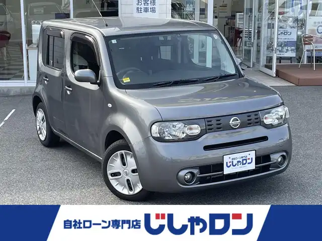 日産 キューブ 15X Vセレクション 山梨県 2016(平28)年 8.3万km ダークメタルグレー (株)IDOMが運営する【じしゃロン甲府店】の自社ローン専用車両になります。/こちらは現金またはオートローンご利用時の価格です。自社ローンご希望の方は別途その旨お申付け下さい/スマートキー２個/純正ナビ・フルセグTV/CD・DVD・BTオーディオ/バックカメラ/ETC/HIDオートライト/保証書・取説書