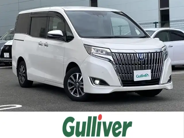 トヨタ エスクァイア ハイブリッド Gi 福岡県 2020(令2)年 7.3万km ホワイトパールクリスタルシャイン ワンオーナー/純正ディーラーナビ（NSZT-Y68T）/（フルセグTV/CD/DVD/Bluetooth）/バックカメラ/純正フリップダウンモニター/前席シートヒーター/レザーシート/クルーズコントロール/ビルトインETC/両側パワースライドドア/ドライブレコーダー/プリクラッシュセーフティ/レーンキープアシスト/プッシュスタート/純正15インチアルミホイール/純正フロアマット/USB充電ポート