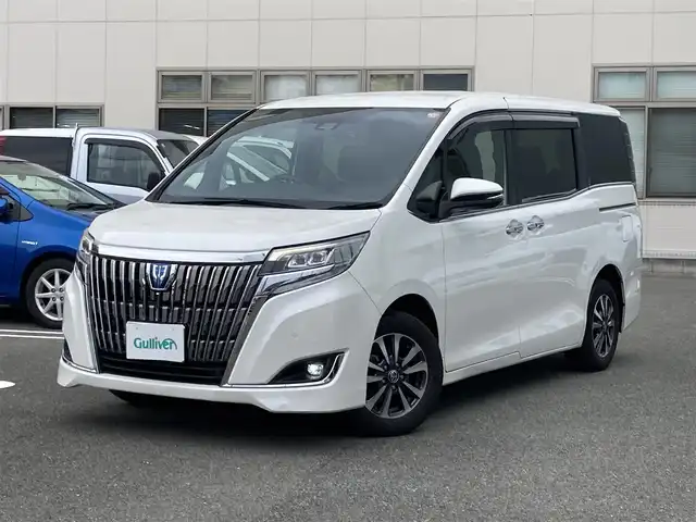 トヨタ エスクァイア ハイブリッド Gi 福岡県 2020(令2)年 7.3万km ホワイトパールクリスタルシャイン ワンオーナー/純正ディーラーナビ（NSZT-Y68T）/（フルセグTV/CD/DVD/Bluetooth）/バックカメラ/純正フリップダウンモニター/前席シートヒーター/レザーシート/クルーズコントロール/ビルトインETC/両側パワースライドドア/ドライブレコーダー/プリクラッシュセーフティ/レーンキープアシスト/プッシュスタート/純正15インチアルミホイール/純正フロアマット/USB充電ポート