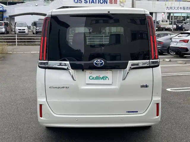 トヨタ エスクァイア ハイブリッド Gi 福岡県 2020(令2)年 7.3万km ホワイトパールクリスタルシャイン ワンオーナー/純正ディーラーナビ（NSZT-Y68T）/（フルセグTV/CD/DVD/Bluetooth）/バックカメラ/純正フリップダウンモニター/前席シートヒーター/レザーシート/クルーズコントロール/ビルトインETC/両側パワースライドドア/ドライブレコーダー/プリクラッシュセーフティ/レーンキープアシスト/プッシュスタート/純正15インチアルミホイール/純正フロアマット/USB充電ポート