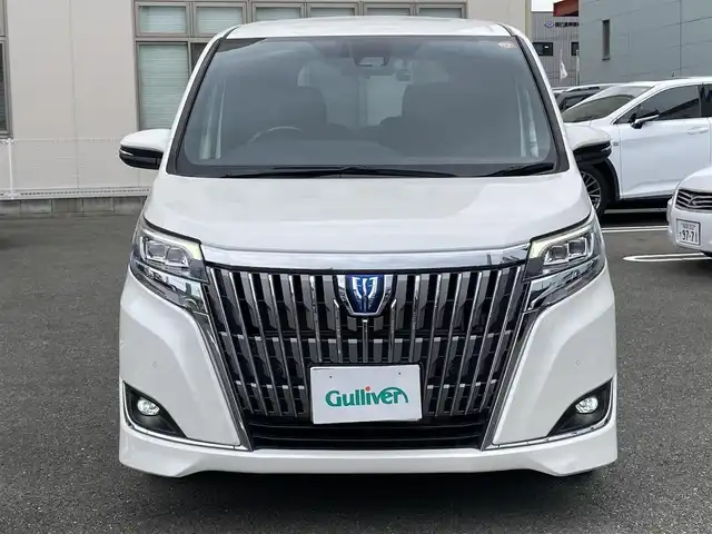 トヨタ エスクァイア ハイブリッド Gi 福岡県 2020(令2)年 7.3万km ホワイトパールクリスタルシャイン ワンオーナー/純正ディーラーナビ（NSZT-Y68T）/（フルセグTV/CD/DVD/Bluetooth）/バックカメラ/純正フリップダウンモニター/前席シートヒーター/レザーシート/クルーズコントロール/ビルトインETC/両側パワースライドドア/ドライブレコーダー/プリクラッシュセーフティ/レーンキープアシスト/プッシュスタート/純正15インチアルミホイール/純正フロアマット/USB充電ポート