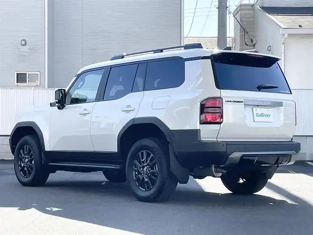 トヨタ ランドクルーザー ２５０ VX 栃木県 2024(令6)年 0.1万km プラチナホワイトパールマイカ モデリスタパッケージ/・フロントバンパーガード/・フロントアンダーカバー/・リヤバンパーガーニッシュ/トヨタチームメイト［アドバンスト ドライブ(渋滞時支援)］ /ToyotaSafetySense/・プリクラッシュセーフティ(歩行者［昼夜］・自転車運転者［昼夜］・自動二輪車［昼］検知機能付衝突回避支援タイプ/ミリ波レーダー+単眼カメラ方式)/・緊急時操舵支援(アクティブ操舵機能付)+フロントクロストラフィックアラート［FCTA］+レーンチェンジアシスト［LCA］/・レーントレーシングアシスト［LTA］+レーンディパーチャーアラート［LDA］/・レーダークルーズコントロール(全車速追従機能付)/・オートマチックハイビーム［AHB］/・プロアクティブドライビングアシスト［PDA］/ブラインドスポットモニター［BSM］+安心降車アシスト［SEA］+後方車両接近告知+周辺車両接近時サポート(通報提案機能)+後方車両への接近警報＋セカンダリーコリジョンブレーキ(停車中後突対応)/パノラミックビューモニター/12.3インチディスプレイオーディオ(コネクティッドナビ対応)Plus+トヨタプレミアムサウンドシステム/デジタルインナーミラー/ドライブレコーダー