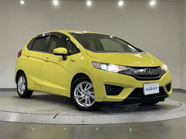 ホンダ フィット ハイブリット Lパッケージ 愛知県 2014(平26)年 8.2万km アトラクトイエローパール 純正ナビ/・AM/FM/CD/DVD/Bluetooth/・フルセグテレビ/衝突軽減ブレーキ/クルーズコントロール/バックカメラ/ETC/純正15インチアルミホイル/LEDヘッドライト/スマートキー/スペアキー/プッシュスタートボタン/オートライト/オートエアコン/電格ミラー/ドアバイザー/純正フロアマット/保証書/取扱説明書