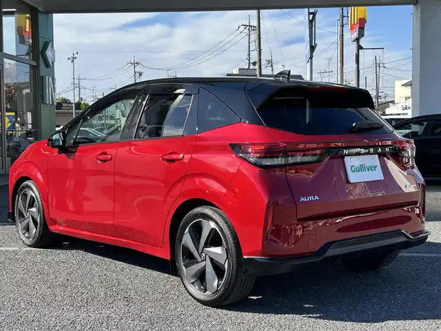 日産 オーラ G レザーエディション 埼玉県 2023(令5)年 0.2万km ガーネットレッド/スーパーブラック 2トーン ・ワンオーナー　/・純正フロント＆リアアンダースポイラー　/・純正ナビフルセグＴＶ　/・ナビ連動前後ドライブレコーダー　/・アラウンドビューモニター　/・デジタルインナーミラー　/・ＥＴＣ２．０　/・黒皮シート/・スマートキー×２/・プッシュスタート/・電子パーキング/・オートホールド　/・純正１７インチアルミ/・ブリジストンタイヤ/・オートライト/・LEDヘットライト/・LEDフォグライト/・保証書/・取説