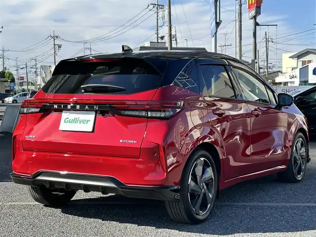 日産 オーラ G レザーエディション 埼玉県 2023(令5)年 0.2万km ガーネットレッド/スーパーブラック 2トーン ・ワンオーナー　/・純正フロント＆リアアンダースポイラー　/・純正ナビフルセグＴＶ　/・ナビ連動前後ドライブレコーダー　/・アラウンドビューモニター　/・デジタルインナーミラー　/・ＥＴＣ２．０　/・黒皮シート/・スマートキー×２/・プッシュスタート/・電子パーキング/・オートホールド　/・純正１７インチアルミ/・ブリジストンタイヤ/・オートライト/・LEDヘットライト/・LEDフォグライト/・保証書/・取説