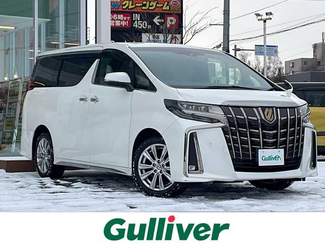 トヨタ アルファード S タイプゴールド 道央・札幌 2020(令2)年 7.8万km ホワイトパールクリスタルシャイン ・4WD/・寒冷地仕様/・トヨタ純正ディスプレイオーディオ/（CD/DVD/BＴ/TV/AM/FM/ナビ）/・バックカメラ/・純正フリップダウンモニター/・トヨタセーフティセンス/・プリクラッシュセーフティ/・レーントレーシングアシスト/・レーンディパーチャーアラート/・ロードサインアシスト/・レーダークルーズコントロール/・オートマチックハイビーム/・先行車発進アラーム/・コーナーセンサー/・SOSコール/・ビルトインETC/・社外前後ドライブレコーダー/・両側パワースライドドア/・ハーフレザーシート/・電動リアゲート/・純正18インチAW/・純正フロアマット/・プラスチックバイザー/・LEDヘッドライト/・フォグランプ/・リアフォグランプ/・プッシュスタート/・スマートキー/・電動パーキングブレーキ/・オートホールド