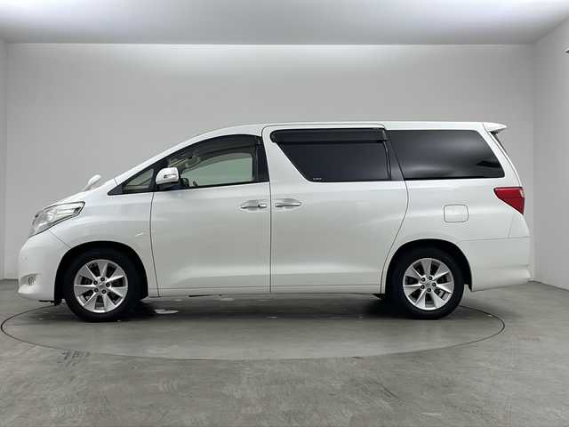 トヨタ アルファード 240G 兵庫県 2010(平22)年 8.1万km ホワイトパールクリスタルシャイン 純正7インチHDDナビ（NHZA-W66G）/CD/DVD/ワンセグ/BT/バックカメラ/ビルトインETC/純正フリップダウンモニター/クルーズコントロール/両側パワースライドドア/運転席・助手席パワーシート/レザー調シートカバー/ウッド調コンビステアリング/純正17インチアルミホイール/クリアランスソナー/プッシュスタート/スマートキー/オットマン/オートライト/ディスチャージヘッドライト