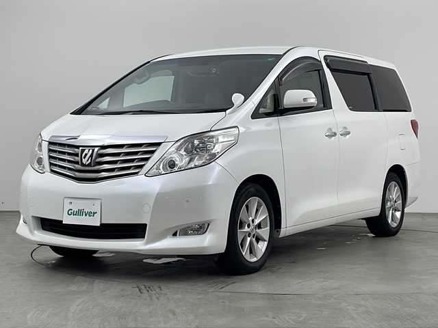 トヨタ アルファード 240G 兵庫県 2010(平22)年 8.1万km ホワイトパールクリスタルシャイン 純正7インチHDDナビ（NHZA-W66G）/CD/DVD/ワンセグ/BT/バックカメラ/ビルトインETC/純正フリップダウンモニター/クルーズコントロール/両側パワースライドドア/運転席・助手席パワーシート/レザー調シートカバー/ウッド調コンビステアリング/純正17インチアルミホイール/クリアランスソナー/プッシュスタート/スマートキー/オットマン/オートライト/ディスチャージヘッドライト