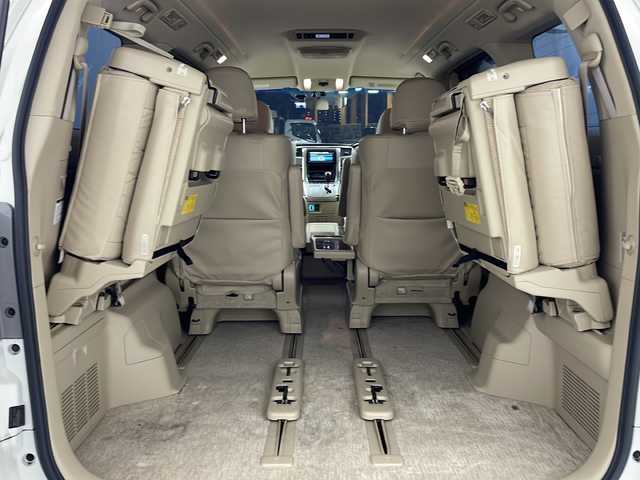 トヨタ アルファード 240G 兵庫県 2010(平22)年 8.1万km ホワイトパールクリスタルシャイン 純正7インチHDDナビ（NHZA-W66G）/CD/DVD/ワンセグ/BT/バックカメラ/ビルトインETC/純正フリップダウンモニター/クルーズコントロール/両側パワースライドドア/運転席・助手席パワーシート/レザー調シートカバー/ウッド調コンビステアリング/純正17インチアルミホイール/クリアランスソナー/プッシュスタート/スマートキー/オットマン/オートライト/ディスチャージヘッドライト
