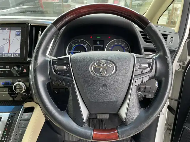 トヨタ アルファードハイブリット X 長野県 2015(平27)年 9.6万km ホワイトパールクリスタルシャイン 4WD/純正ナビ/・Bluetooth/CD/DVD/TV/バックカメラ/純正ETC/前方ドライブレコーダー/純正フロアマット/片側パワースライド/シートカバー/純正15インチAW/コーナーセンサー前後/LEDオートライト/クルーズコントロール追走あり/JBLサウンド/電格ミラー/ドアバイザー/スマートキー/取り扱い説明書/保証書