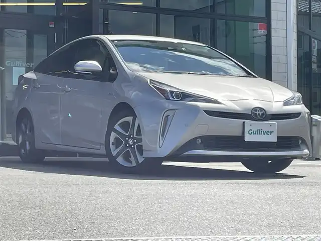 トヨタ プリウス A ツーリングセレクション 愛媛県 2019(平31)年 4.4万km スティールブロンドM 純正7型ナビ(AM/FM/CD/DVD/BT/ワンセグTV)/バックカメラ/白革温電動シート/トヨタセーフティセンス/レーダークルーズコントロール/ブラインドスポットモニター/ヘッドアップディスプレイ/衝突被害軽減装置/車線逸脱防止装置/パーキングアシスト/ヒートミラー/電格ミラー/純正ドアバイザー/ステアリングリモコン/後付けドリンクホルダー/PWR/NORMAL/ECO/トノカバー/現状サマー(純正AW)(215/45/R17)/PIRELLI P8FS