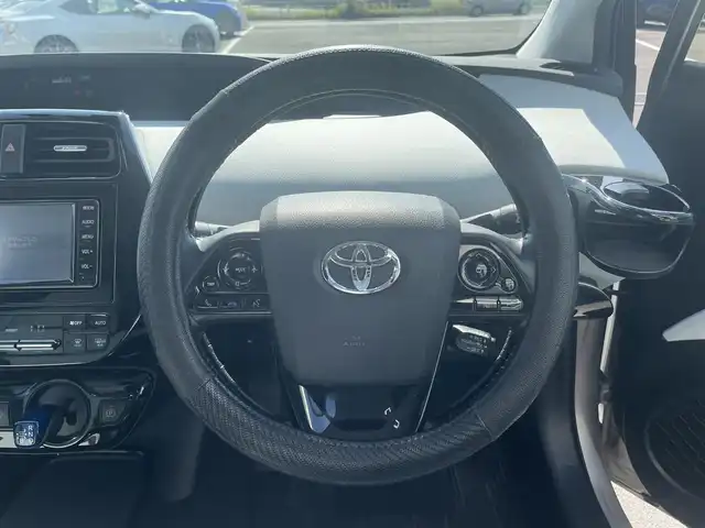 トヨタ プリウス A ツーリングセレクション 愛媛県 2019(平31)年 4.4万km スティールブロンドM 純正7型ナビ(AM/FM/CD/DVD/BT/ワンセグTV)/バックカメラ/白革温電動シート/トヨタセーフティセンス/レーダークルーズコントロール/ブラインドスポットモニター/ヘッドアップディスプレイ/衝突被害軽減装置/車線逸脱防止装置/パーキングアシスト/ヒートミラー/電格ミラー/純正ドアバイザー/ステアリングリモコン/後付けドリンクホルダー/PWR/NORMAL/ECO/トノカバー/現状サマー(純正AW)(215/45/R17)/PIRELLI P8FS