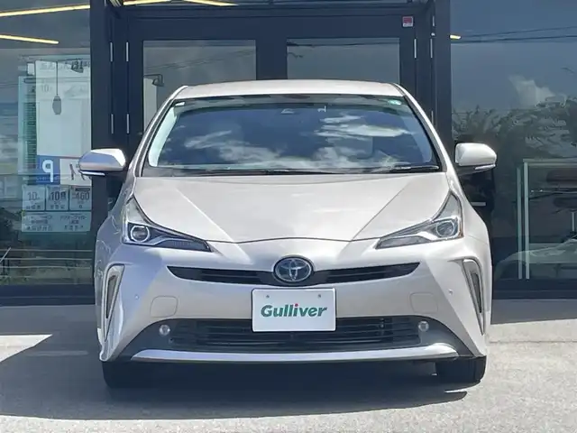 トヨタ プリウス A ツーリングセレクション 愛媛県 2019(平31)年 4.4万km スティールブロンドM 純正7型ナビ(AM/FM/CD/DVD/BT/ワンセグTV)/バックカメラ/白革温電動シート/トヨタセーフティセンス/レーダークルーズコントロール/ブラインドスポットモニター/ヘッドアップディスプレイ/衝突被害軽減装置/車線逸脱防止装置/パーキングアシスト/ヒートミラー/電格ミラー/純正ドアバイザー/ステアリングリモコン/後付けドリンクホルダー/PWR/NORMAL/ECO/トノカバー/現状サマー(純正AW)(215/45/R17)/PIRELLI P8FS