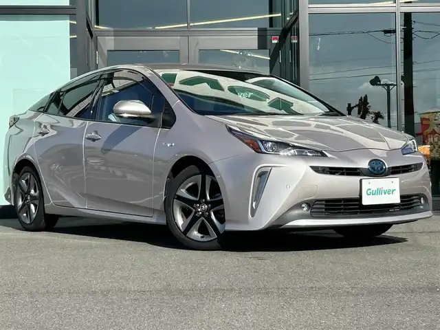 トヨタ プリウス A ツーリングセレクション 愛媛県 2019(平31)年 4.4万km スティールブロンドM 純正7型ナビ(AM/FM/CD/DVD/BT/ワンセグTV)/バックカメラ/白革温電動シート/トヨタセーフティセンス/レーダークルーズコントロール/ブラインドスポットモニター/ヘッドアップディスプレイ/衝突被害軽減装置/車線逸脱防止装置/パーキングアシスト/ヒートミラー/電格ミラー/純正ドアバイザー/ステアリングリモコン/後付けドリンクホルダー/PWR/NORMAL/ECO/トノカバー/現状サマー(純正AW)(215/45/R17)/PIRELLI P8FS
