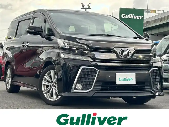 トヨタ ヴェルファイア Z Aエディション 愛知県 2015(平27)年 18.8万km バーニングブラッククリスタルシャインガラスフレーク ワンオーナー /スマートキー/プッシュスタート/純正9インチナビ/フルセグTV/BT/バックカメラ/純正フリップダウンモニター/ビルトインETC/純正18インチAW/両側パワースライドドア /クルーズコントロール/クリアランスソナー /純正フロアマット/純正ドアバイザー/LEDヘッドライト/フォグランプ/取説、保証書