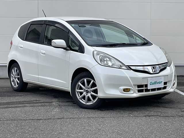 ホンダ フィット X 岩手県 2011(平23)年 7.5万km プレミアムホワイトパール 寒冷地仕様 ナビ ワンセグ クルーズコントロール ビルドインETC ステアリングスイッチ 電格ミラー ミラーヒーター シートヒーター エンジンスターター