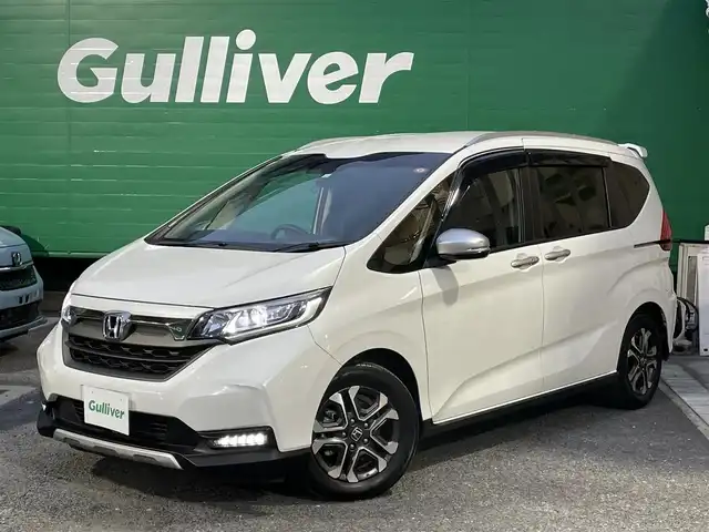 ホンダ フリード＋ ハイブリット クロスター 東京都 2022(令4)年 3.9万km プラチナホワイトパール ワンオーナー/純正SDナビ【NMX-234VFi】/(DVD/フルセグTV/Bluetooth）/バックカメラ/ホンダセンシング/・アダクティブクルーズコントロール/・路外逸脱抑制機能/・誤発進抑制機能/・衝突軽減ブレーキ/ハーフレザーシート/前席シートヒーター/両側パワースライドドア/革ステアリング/LEDライト/アクティブコーナリングランプ/ETC/スペアキー×1/取扱説明書/保証書