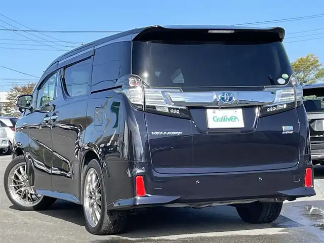 トヨタ ヴェルファイア ハイブリット ZR Gエディション 道央・札幌 2017(平29)年 9.2万km スパークリングブラックパールクリスタルシャイン ４WD/ワンオーナー/寒冷地仕様/純正ディーラーOPナビ/CD/DVD/BT/フルセグ/純正フリップダウンモニター/横滑り防止装置/クルーズコントロール/クリアランスソナー/バックカメラ/ビルトインETC/ドライブレコーダー/ワイパーデアイサー/EVMODE/ECOMODE/ツインサンルーフ/両側パワースライドドア/パワーバックドア/前席/２列目パワーシート/D席メモリーシート/前席シートヒーター/N席/２列目オットマン/レザーシート/革巻きステアリング/ステアリングリモコン/ハンドルヒーター/AC100V/電動パーキング/ブレーキホールド/MTモード付AT/自動防眩ミラー/プッシュスタート/純正リモートスタート/スマートキー/LEDヘッドライト/オートライト/オートハイビーム/フォグランプ/電動格納ミラー/ウィンカーミラー/純正フロアマット/ドアバイザー/スペアキー