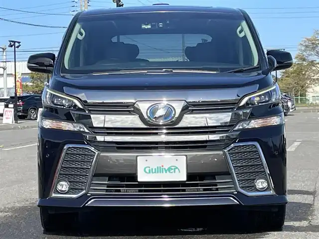トヨタ ヴェルファイア ハイブリット ZR Gエディション 道央・札幌 2017(平29)年 9.2万km スパークリングブラックパールクリスタルシャイン ４WD/ワンオーナー/寒冷地仕様/純正ディーラーOPナビ/CD/DVD/BT/フルセグ/純正フリップダウンモニター/横滑り防止装置/クルーズコントロール/クリアランスソナー/バックカメラ/ビルトインETC/ドライブレコーダー/ワイパーデアイサー/EVMODE/ECOMODE/ツインサンルーフ/両側パワースライドドア/パワーバックドア/前席/２列目パワーシート/D席メモリーシート/前席シートヒーター/N席/２列目オットマン/レザーシート/革巻きステアリング/ステアリングリモコン/ハンドルヒーター/AC100V/電動パーキング/ブレーキホールド/MTモード付AT/自動防眩ミラー/プッシュスタート/純正リモートスタート/スマートキー/LEDヘッドライト/オートライト/オートハイビーム/フォグランプ/電動格納ミラー/ウィンカーミラー/純正フロアマット/ドアバイザー/スペアキー