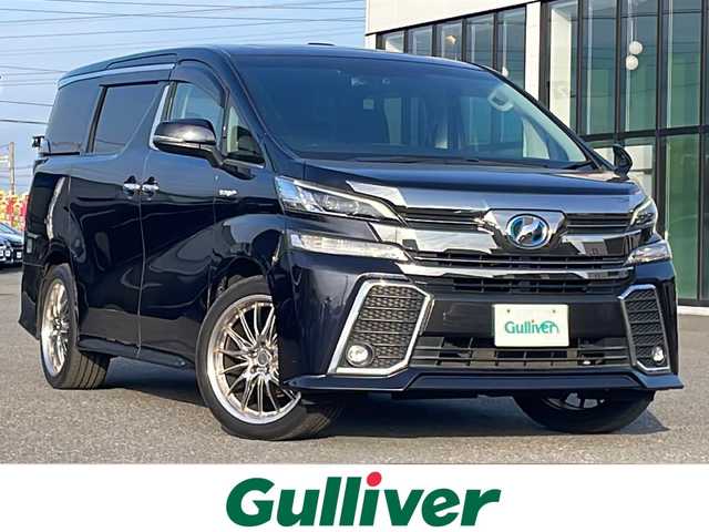 トヨタ ヴェルファイア ハイブリット ZR Gエディション 道央・札幌 2017(平29)年 9.2万km スパークリングブラックパールクリスタルシャイン ４WD/ワンオーナー/寒冷地仕様/純正ディーラーOPナビ/CD/DVD/BT/フルセグ/純正フリップダウンモニター/横滑り防止装置/クルーズコントロール/クリアランスソナー/バックカメラ/ビルトインETC/ドライブレコーダー/ワイパーデアイサー/EVMODE/ECOMODE/ツインサンルーフ/両側パワースライドドア/パワーバックドア/前席/２列目パワーシート/D席メモリーシート/前席シートヒーター/N席/２列目オットマン/レザーシート/革巻きステアリング/ステアリングリモコン/ハンドルヒーター/AC100V/電動パーキング/ブレーキホールド/MTモード付AT/自動防眩ミラー/プッシュスタート/純正リモートスタート/スマートキー/LEDヘッドライト/オートライト/オートハイビーム/フォグランプ/電動格納ミラー/ウィンカーミラー/純正フロアマット/ドアバイザー/スペアキー