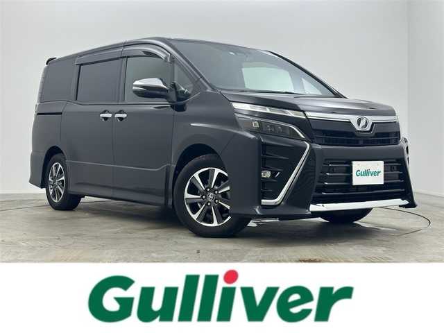トヨタ ヴォクシー ZS 煌Ⅱ 岡山県 2020(令2)年 7.5万km ブラック 純正１０インチナビ/（Bluetooth/フルセグTV/USB/HDMI）/クルーズコントロール/衝突軽減ブレーキシステム/両側パワースライドドア/ビルトインＥＴＣ/LEDヘッドライト＆フォグ/オートハイビーム/オートライト/純正ドライブレコーダー（前後）/踏み間違い防止/横滑り防止装置/レーンアシスト/コーナーセンサー（前後）/アイドリングストップ/純正フロアマット/後席サンシェイド/シートバックテーブル/プッシュスタート/スマートキー×2