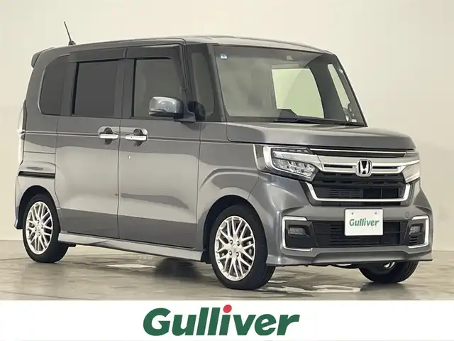 ホンダ Ｎ ＢＯＸ カスタム L ターボ 滋賀県 2021(令3)年 6.5万km シャイニンググレーM 純正ナビ/(フルセグ/SD/DVD/Bluetooth)/追従クルーズコントロール/両側電動/ＥＴＣ/ドライブレコーダー/シートヒーター/バックカメラ/ハーフレザーシート/ＬＥＤ/オートライト/オートハイビーム/クリアランスソナー/レーンキープアシスト/衝突軽減システム/横滑り防止装置/プッシュスタート/スマートキー×2