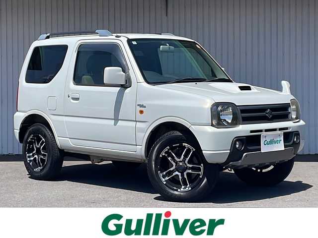 スズキ ジムニー ワイルドウィンド 長野県 2006(平18)年 10.5万km パールホワイトマイカ ４WD/ターボ/カロッツェリアCD/社外１６インチアルミ/ルーフレール/背面タイヤ/保証書・取説/スペアキー