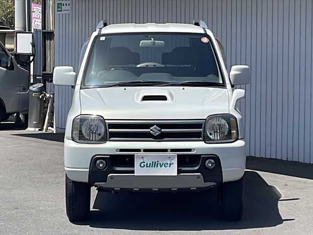 スズキ ジムニー ワイルドウィンド 長野県 2006(平18)年 10.5万km パールホワイトマイカ ４WD/ターボ/カロッツェリアCD/社外１６インチアルミ/ルーフレール/背面タイヤ/保証書・取説/スペアキー