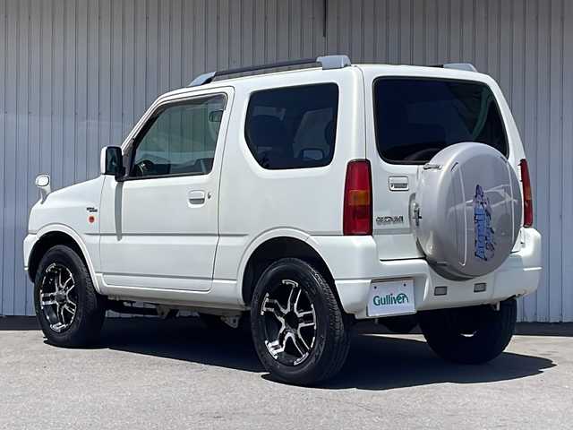 スズキ ジムニー ワイルドウィンド 長野県 2006(平18)年 10.5万km パールホワイトマイカ ４WD/ターボ/カロッツェリアCD/社外１６インチアルミ/ルーフレール/背面タイヤ/保証書・取説/スペアキー