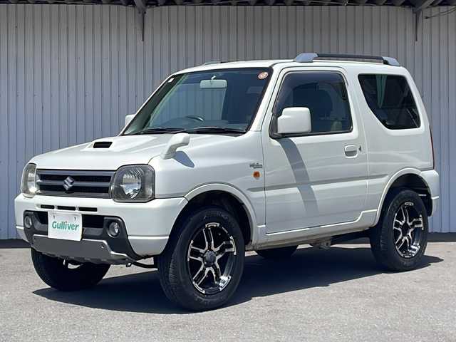 スズキ ジムニー ワイルドウィンド 長野県 2006(平18)年 10.5万km パールホワイトマイカ ４WD/ターボ/カロッツェリアCD/社外１６インチアルミ/ルーフレール/背面タイヤ/保証書・取説/スペアキー