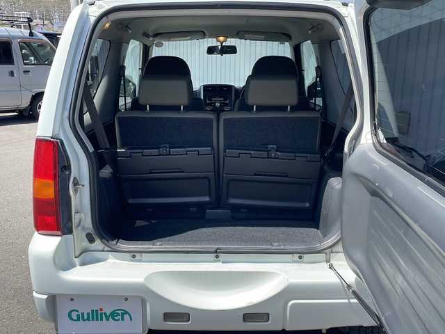 スズキ ジムニー ワイルドウィンド 長野県 2006(平18)年 10.5万km パールホワイトマイカ ４WD/ターボ/カロッツェリアCD/社外１６インチアルミ/ルーフレール/背面タイヤ/保証書・取説/スペアキー