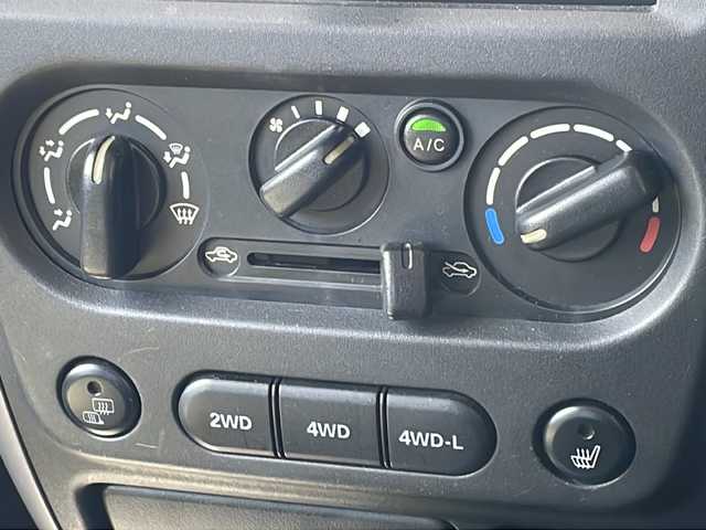スズキ ジムニー ワイルドウィンド 長野県 2006(平18)年 10.5万km パールホワイトマイカ ４WD/ターボ/カロッツェリアCD/社外１６インチアルミ/ルーフレール/背面タイヤ/保証書・取説/スペアキー
