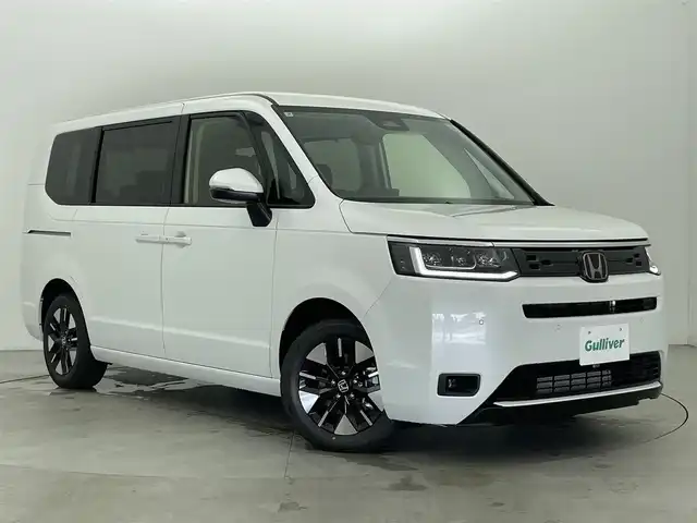 ホンダ ステップワゴン エアー EX 富山県 2025(令7)年 0.1万km未満 プラチナホワイトパール 登録済未使用車/4WD/純正11.4型ナビ（AM/FM/CD/DVD/USB/SD/BT）/フルセグTV/バックカメラ/両側パワースライドドア/衝突軽減ブレーキ/標識認識機能/渋滞追従機能付アダプティブクルーズコントロール/車線維持支援システム/ブラインドスポットインフォメーション/誤発進抑制機能/パーキングセンサーシステム/後退出庫サポート/オートハイビーム/LEDヘッドライト/純正16インチAW/パドルシフト/電動リアゲート/スマートキー×２/プッシュスタート/アイドリングストップ/取扱説明書/保証書