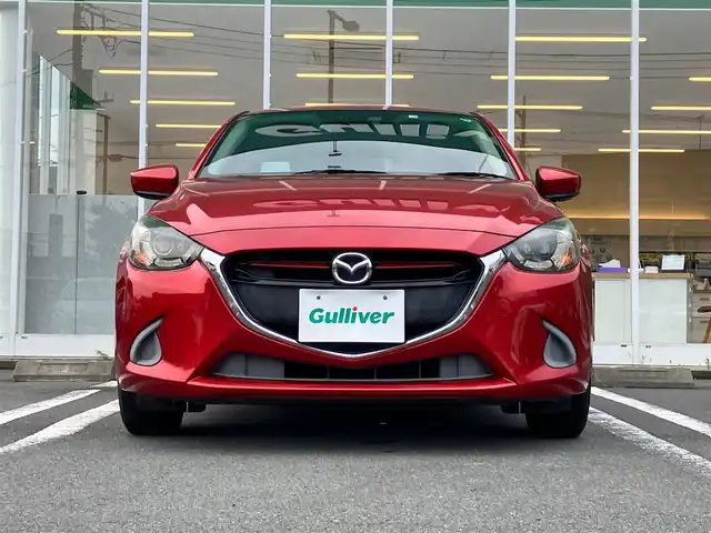 マツダ デミオ 13S Lパッケージ 静岡県 2014(平26)年 8.2万km ソウルレッドプレミアムメタリック エンジンスタートボタン/パワーステアリング/パワーウィンドウ/アイドリングストップ/スマートキー/スペアキー１本/オートエアコン/純正SDナビ（BT）/バックカメラ/ドライブレコーダー/純正フロアマット/純正アルミホイール/ハーフレザー/ABS/横滑り防止装置/オートライト/LEDヘッドライト/W+サイドエアバック/衝突軽減システム/純正アームレスト