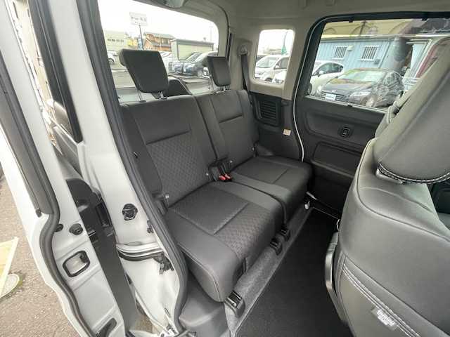 スズキ スペーシア カスタム HYBRID XS 青森県 2022(令4)年 1.5万km ピュアホワイトP ４ＷＤ/HV/社外ナビ（フルセグ/AM/FM）/両側パワースライドドア/リアサーキュレーター/D/N席シートヒーター/パーキングセンサー/コーナーセンサー/衝突軽減システム/横滑り防止装置/アイドリングストップ/165/55/15純正アルミホイール夏タイヤ/社外エンジンスターター/スペアキー/ＥＴＣ/保証書/取扱説明書