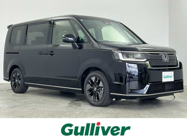 ホンダ ステップワゴン スパーダ eHEV 愛知県 2025(令7)年 0.1万km未満 クリスタルブラックパール 登録済み未使用車/ホンダセンシング/純正11.4インチHONDA　CONNECTナビ/（Bluetooth/CD/DVD/AppleCarPlay/フルセグTV）/バックカメラ/ハーフレザー/シートヒーター/電動リアゲード/両側パワースライドドア/格納シート/純正LEDライト/コーナリングライト/オットマン/純正16インチAW/パドルシフト