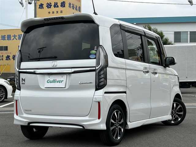 ホンダ Ｎ ＢＯＸ カスタム G L ホンダセンシング 愛媛県 2019(平31)年 5.8万km プラチナホワイトパール 登録時走行距離：57429Km/ディーラーOP純正メモリナビ/フルセグTV/Bluetooth/CD/DVD/AM/FM/ビルトインETC/後コーナーセンサー/スマートキー/スペアキー/ベンチシート/両側パワスラ/横滑り防止装置/衝突軽減システム/レーンキープアシスト/LEDヘッドライト/オートライト/フォグランプ/エンジンスタートボタン/スマートキー/スペアキー/純正アルミホイール/純正フロアマット/サンシェード