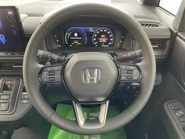 ホンダ ステップワゴン スパーダ eHEV 愛知県 2025(令7)年 0.1万km未満 黒 登録済み未使用車/ホンダセンシング/　・衝突軽減ブレーキ/　・誤発進抑制機能/　・後方誤発進抑制機能/　・近距離衝突軽減ブレーキ/　・歩行者事故低減ステアリング/　・路外越脱抑制機能/　・アダプティブクルーズコントロール/　・車線維持支援システム/　・トラフィックジャムアシスト/　・先行発進知らせ機能/　・標識認識機能/　・オートハイビーム/ホンダパーソナルアシスト/純正11.4インチHONDA　CONNECTナビ/　（Bluetooth/CD/Apple CarPlay/）/バックカメラ/ディライト/ハーフレザー/シートヒーター/本革ステアリング/シートバックテーブル/両側パワースライドドア/電動リアゲード/3列目格納シート/純正LEDライト/コーナリングライト/パドルシフト/オットマン
